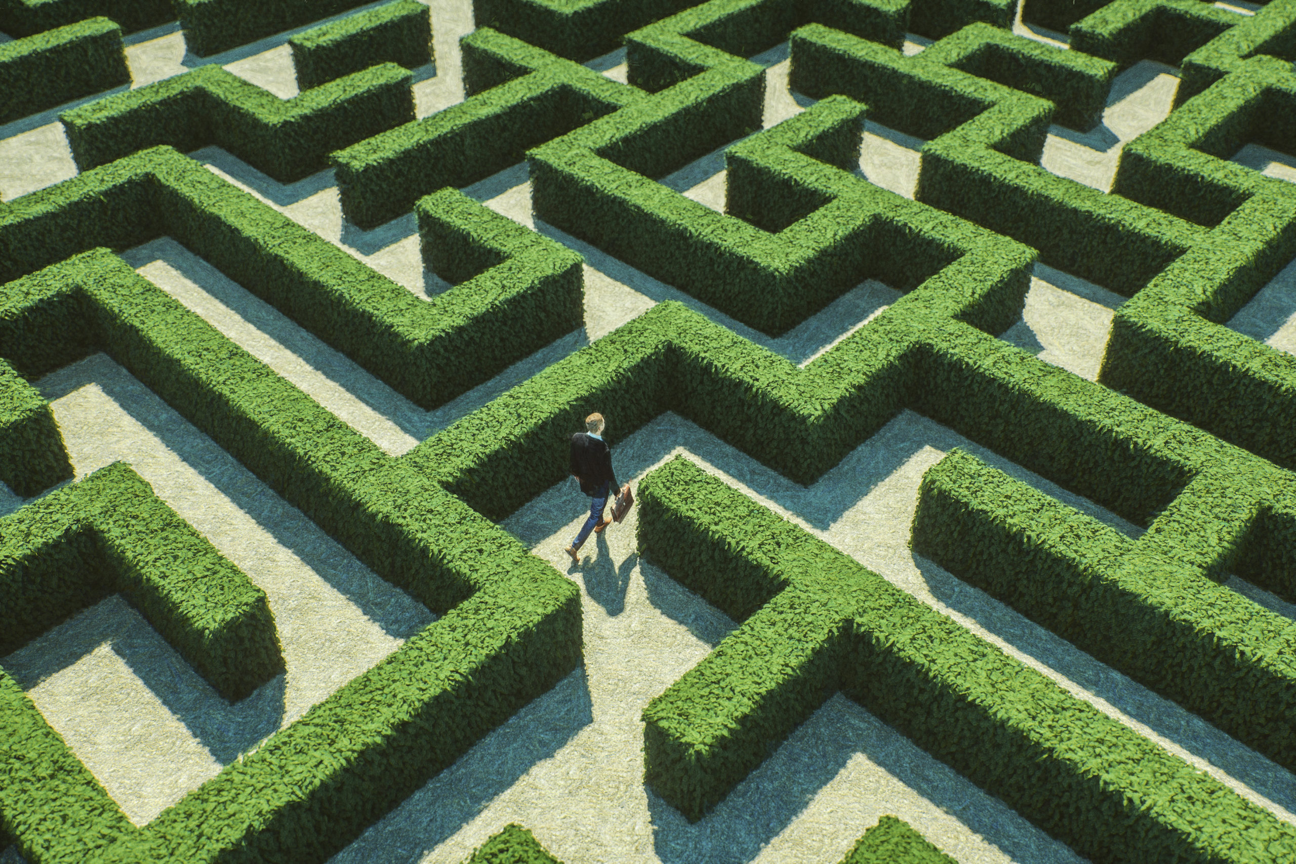 Businessman walking in maze Businessman walking in maze
