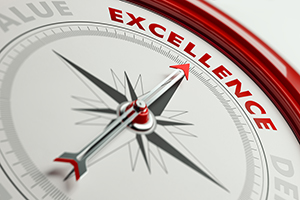 Excellence Concept: Arrow of A Compass Pointing Excellence Text compass towards excellence